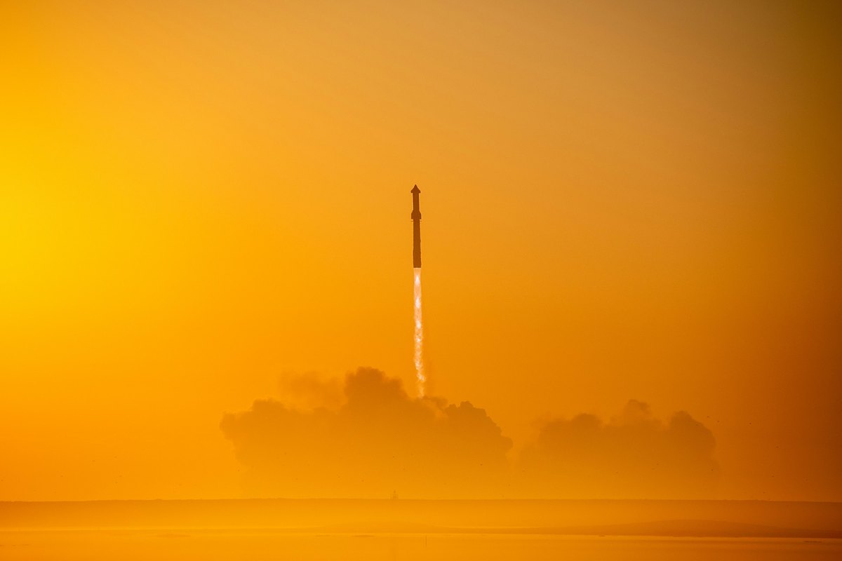 SpaceX Starship rocket launching at sunrise